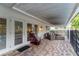 Patio with space for lounge seating, creating a great place to unwind by the backyard pool at 10609 Orange Grove Dr, Tampa, FL 33618