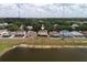 This home is nestled among lush trees and offers water views at 13420 Copper Head Dr, Riverview, FL 33569