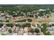 Home next to a pond with mature trees and green spaces at 13420 Copper Head Dr, Riverview, FL 33569