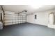 Spacious garage with ample storage, epoxy floor and electric door at 13420 Copper Head Dr, Riverview, FL 33569