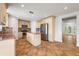 Modern kitchen with stainless steel appliances, center island, and tiled flooring at 13420 Copper Head Dr, Riverview, FL 33569