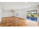Bright open living space with a sliding door and a ceiling fan at 13420 Copper Head Dr, Riverview, FL 33569