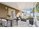 Enjoy this covered patio featuring cozy seating and a dining area perfect for outdoor entertaining at 13622 Tramore Dr, Odessa, FL 33556