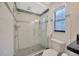 Beautiful bathroom featuring a modern shower with glass door and stylish tile accents at 16141 Gardendale Dr, Tampa, FL 33624