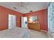 Bedroom featuring dresser, doorway, and white trim at 16261 Amethyst Key Dr, Wimauma, FL 33598