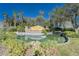 Beautiful community entrance sign with lush landscaping and a tranquil water feature at 16261 Amethyst Key Dr, Wimauma, FL 33598