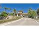 The community's entry features a paved drive, decorative waterfall, and lush landscaping, creating a welcoming atmosphere at 16261 Amethyst Key Dr, Wimauma, FL 33598