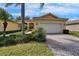 Attractive single-story home boasts a well-maintained lawn and a brick driveway at 16261 Amethyst Key Dr, Wimauma, FL 33598
