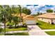 Beautiful single-story home features a lush front yard and a brick driveway at 16261 Amethyst Key Dr, Wimauma, FL 33598
