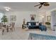 Open concept living room and dining area with tile flooring and lots of natural light at 16261 Amethyst Key Dr, Wimauma, FL 33598