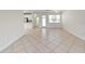 Open-concept living space with tile floors and seamless flow to kitchen area at 16261 Amethyst Key Dr, Wimauma, FL 33598