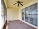 This screened patio has brick floors and is accessible through sliding glass doors at 16261 Amethyst Key Dr, Wimauma, FL 33598