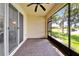 Relaxing screened patio with brick flooring and picturesque water views creates a serene outdoor living space at 16261 Amethyst Key Dr, Wimauma, FL 33598
