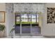 Screened-in patio provides beautiful lake views, enhancing the indoor-outdoor living experience at 16261 Amethyst Key Dr, Wimauma, FL 33598