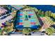 Aerial view of the community's well-maintained pickleball courts and surrounding landscaping at 16261 Amethyst Key Dr, Wimauma, FL 33598