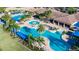 Luxurious swimming pools and lounge area perfect for relaxation and socializing at 16261 Amethyst Key Dr, Wimauma, FL 33598