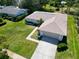 Aerial view of the home showcasing its well-maintained lawn and mature landscaping at 1681 Macdonnell Ct, Palm Harbor, FL 34684