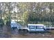 Picturesque view of a boat dock with pontoon boats, surrounded by trees, for easy access to water activities at 1681 Macdonnell Ct, Palm Harbor, FL 34684
