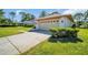 Charming home with a well-manicured lawn, curb appeal and American flag at 1681 Macdonnell Ct, Palm Harbor, FL 34684