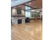 Community meeting room with fireplace, piano, and beautiful hardwood floors at 1681 Macdonnell Ct, Palm Harbor, FL 34684
