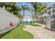 Backyard featuring a custom putting green, perfect for outdoor recreation and entertainment at 1698 Eden Ct, Clearwater, FL 33756