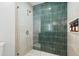 Modern bathroom featuring a glass-enclosed shower with sleek tiling and contemporary fixtures at 1698 Eden Ct, Clearwater, FL 33756