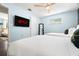 Cozy bedroom with two beds, a stylish mirror, a window, and a TV for entertainment at 1698 Eden Ct, Clearwater, FL 33756
