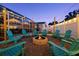 Twilight shot of outdoor firepit and putting green at 1698 Eden Ct, Clearwater, FL 33756