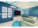 Finished basement game room with couches and wall art at 1698 Eden Ct, Clearwater, FL 33756