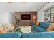 Inviting living room with wood accent wall, stylish furnishings, and a comfortable, modern design at 1698 Eden Ct, Clearwater, FL 33756