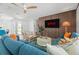Cozy living room showcases a wood accent wall, comfortable seating, and a bright, airy atmosphere at 1698 Eden Ct, Clearwater, FL 33756