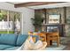 Charming seating area with stone fireplace and stylish decor, perfect for relaxing and entertaining at 1698 Eden Ct, Clearwater, FL 33756