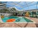 Beautiful screened pool with floats, poolside seating, and a fun outdoor mural at 1698 Eden Ct, Clearwater, FL 33756