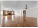 Expansive living room featuring hardwood floors and a brick fireplace at 1702 Miller S Rd, Valrico, FL 33594