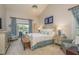 Comfortable main bedroom with a pool view, offering a tranquil and inviting space at 18106 Woodcreek Pl, Lutz, FL 33548