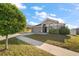 Charming single-story home featuring neutral paint, a well-manicured lawn, and a two-car garage at 18314 Waydale Loop, Hudson, FL 34667
