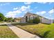 Attractive single-Gathering home with a green lawn, two-car garage, and easy access to sidewalks at 18314 Waydale Loop, Hudson, FL 34667