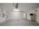 Spacious two car garage featuring ample room for storage at 18314 Waydale Loop, Hudson, FL 34667