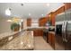 Updated kitchen with stainless steel appliances and granite countertops at 18314 Waydale Loop, Hudson, FL 34667