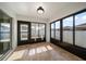 Sun room with tile flooring and plenty of natural light at 18314 Waydale Loop, Hudson, FL 34667