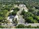 Aerial view of a lot with a winding driveway, trees, and nearby houses at 18483 Purple Creek Ln # Lot 1, Lutz, FL 33549