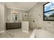 Bathroom featuring marble floors, a glass walk-in shower and an elegant soaking tub at 18483 Purple Creek Ln # Lot 1, Lutz, FL 33549