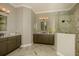 Neutral-toned bathroom with double vanity, marble floors, and walk-in shower at 18483 Purple Creek Ln # Lot 1, Lutz, FL 33549