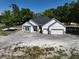 Charming single story home featuring a two car garage and landscaped front yard at 18483 Purple Creek Ln # Lot 1, Lutz, FL 33549