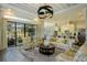 Bright living room with modern furniture, backyard views and connected to kitchen at 18483 Purple Creek Ln # Lot 1, Lutz, FL 33549