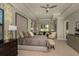 Spacious main bedroom featuring a sitting area, modern furniture and tray ceilings at 18483 Purple Creek Ln # Lot 1, Lutz, FL 33549
