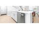 Well-appointed kitchen island offers counter seating, stainless steel appliances, and modern cabinetry at 19195 Blue Pond Dr, Lutz, FL 33558
