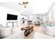 Open concept living space connecting the living room, kitchen, and dining area for seamless entertaining at 19195 Blue Pond Dr, Lutz, FL 33558