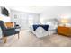Serene bedroom featuring neutral tones, soft carpeting, and plenty of natural light, creating a peaceful retreat at 19195 Blue Pond Dr, Lutz, FL 33558