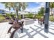 Community patio area featuring comfortable chairs and a modern fire pit at 19195 Blue Pond Dr, Lutz, FL 33558